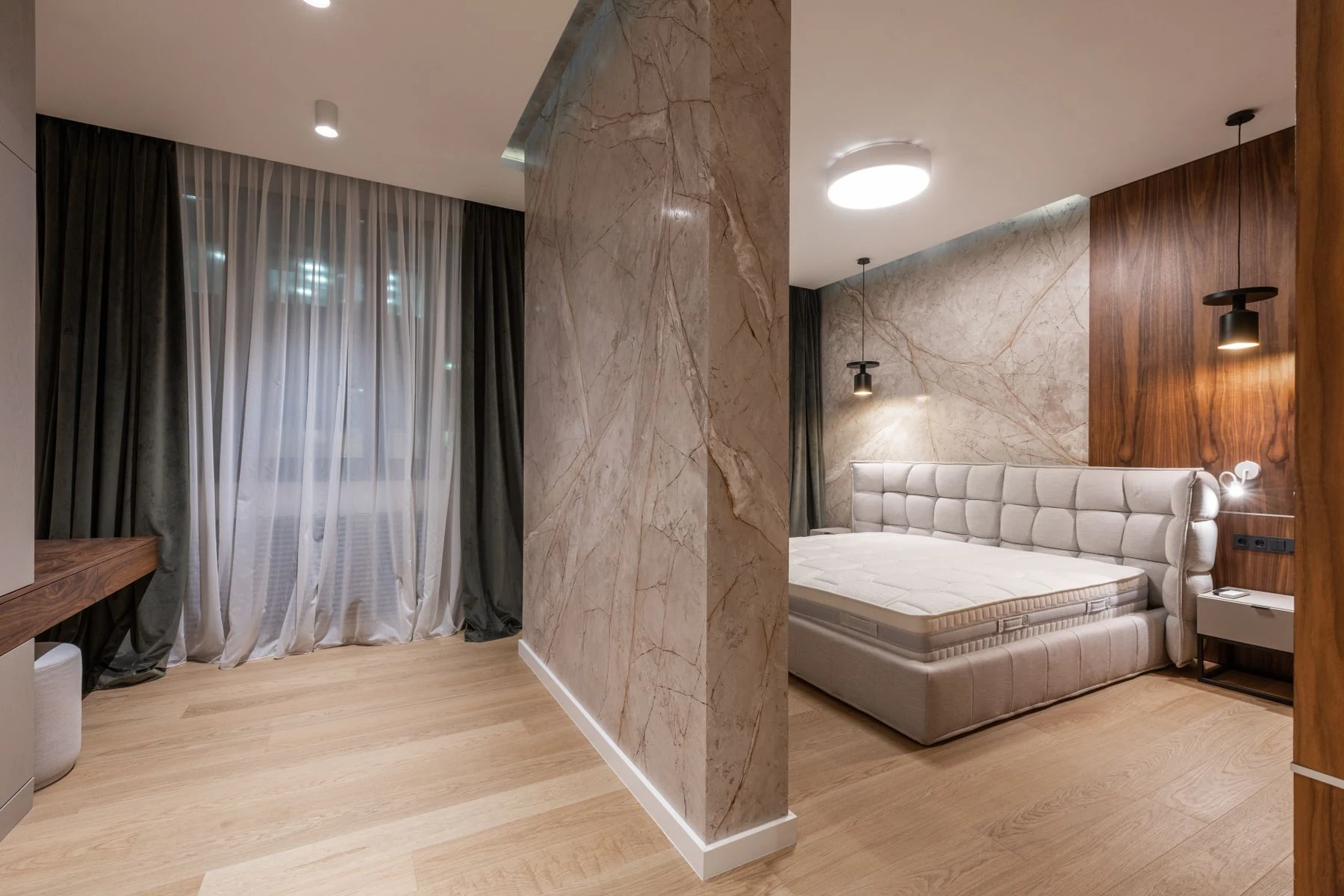 A luxurious and modern bedroom featuring minimalist design and elegant decor. Reference photograph for Sela Residence.